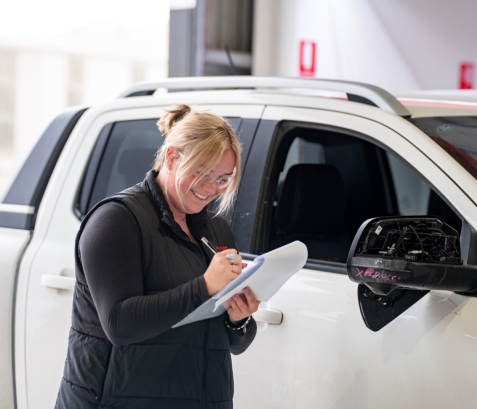 lady performing checklist on ute